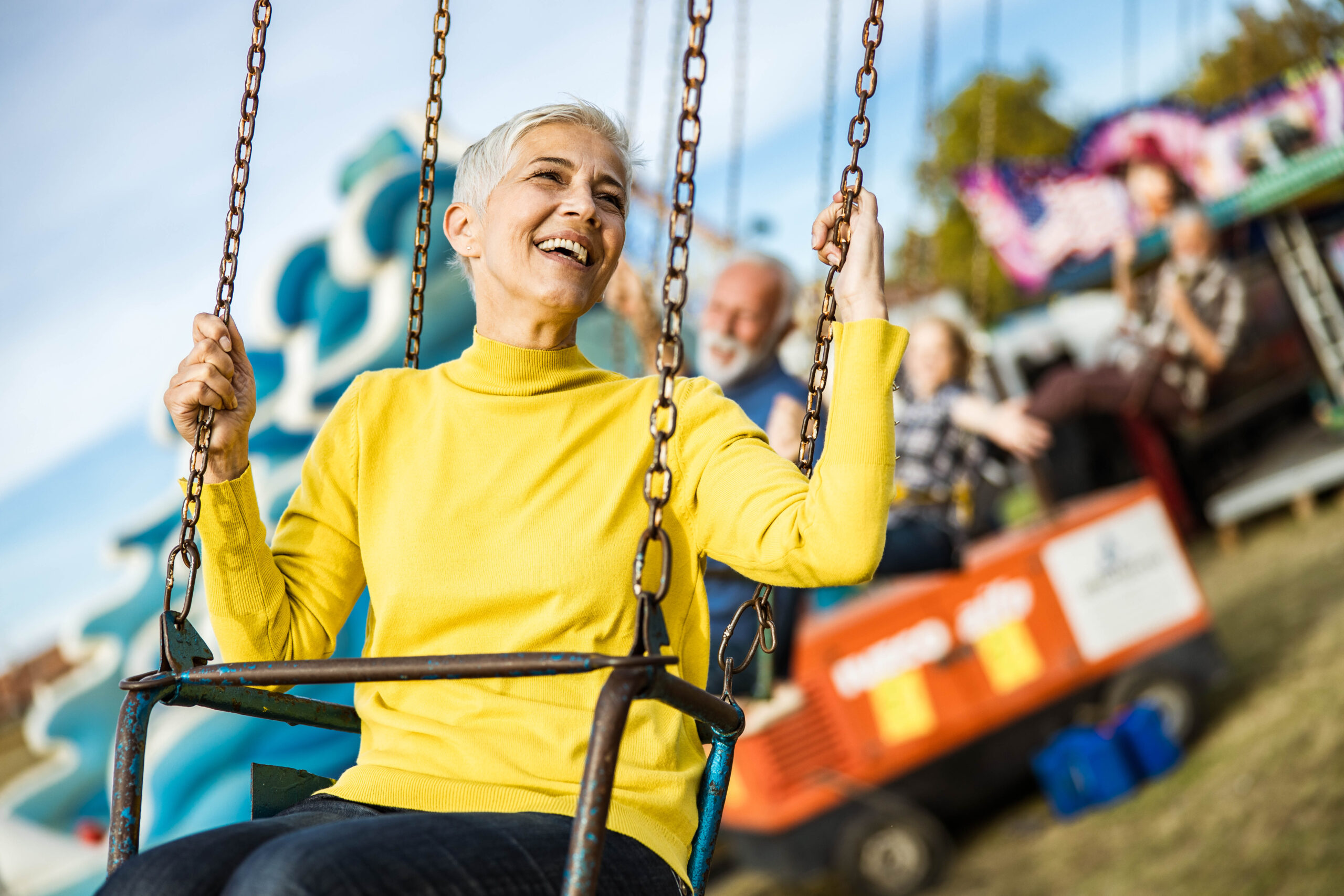 Happy Mature Women Having Fun On Swing