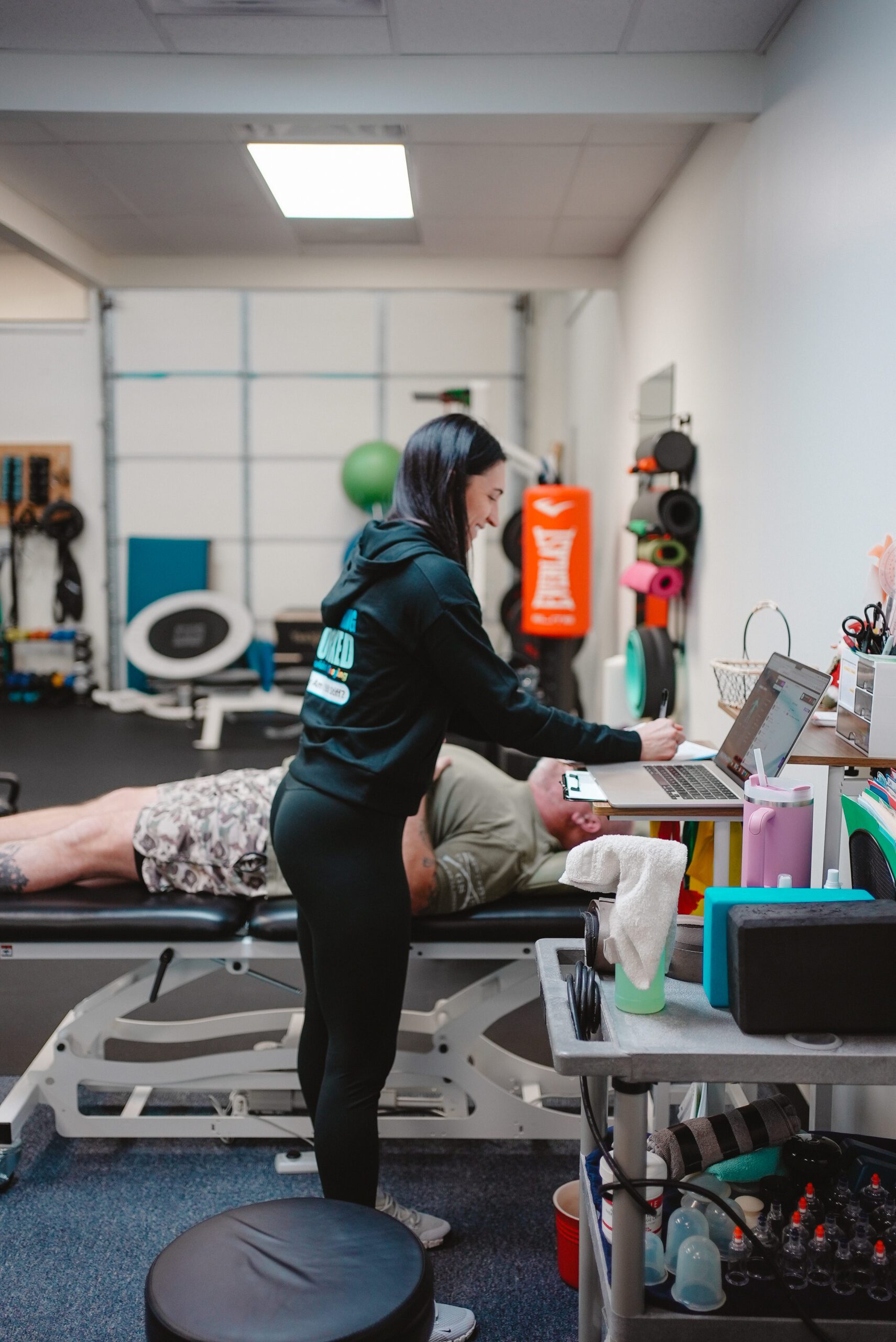 the stretch mobility coach Kim Nartker stretching a patient's leg