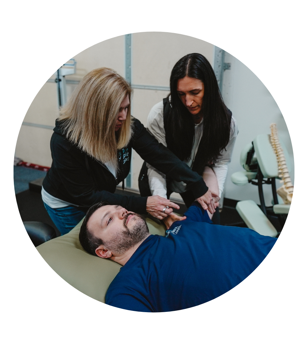 Kim Nartker stretching a patient's leg